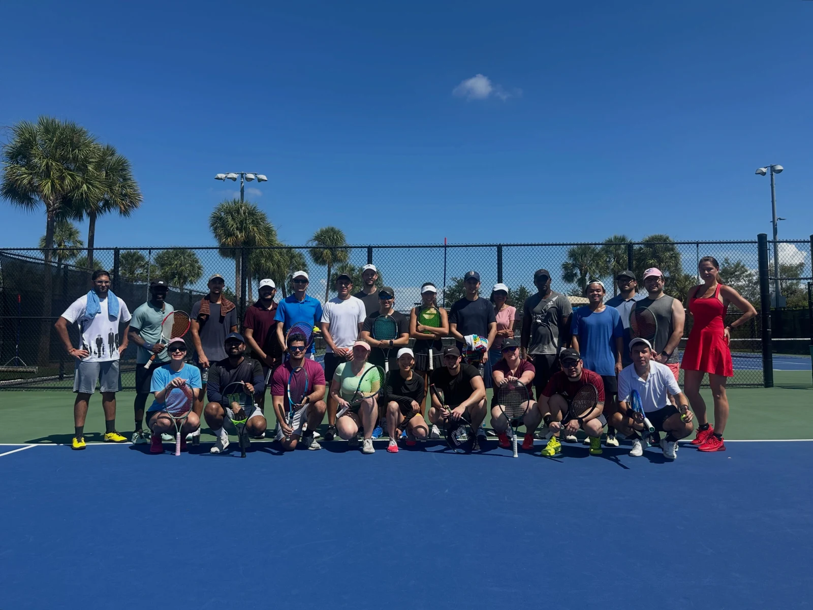 Florida Tennis Partners players together for a community hitting session